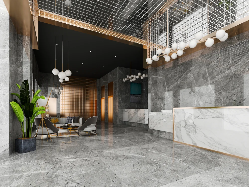 Modern luxury lobby design featuring marble accents, warm lighting, and contemporary furniture in a high-end building in NYC and Astoria, NY